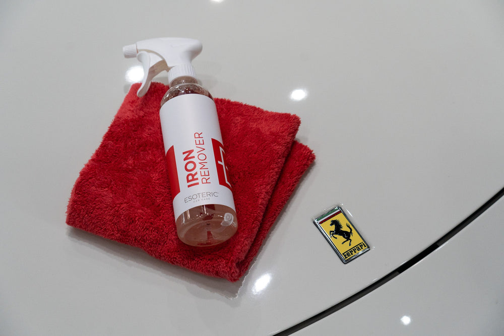 ESOTERIC Iron Remover and microfiber towel on painted surface